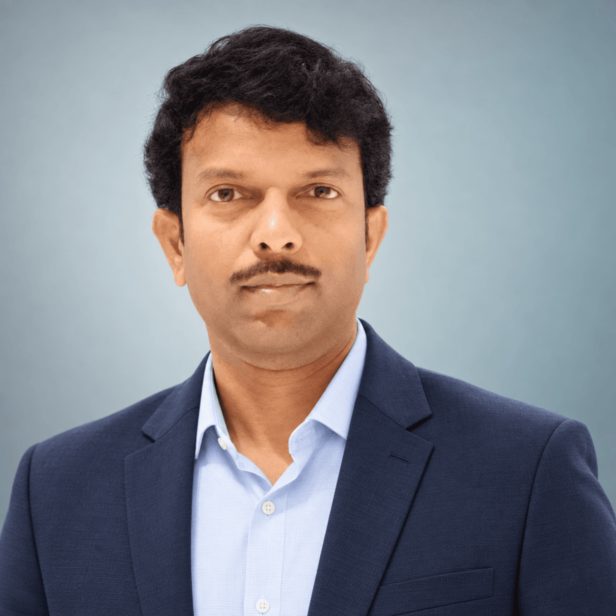 Portrait of Krishna Mogulluri, founder of PraxiMeta